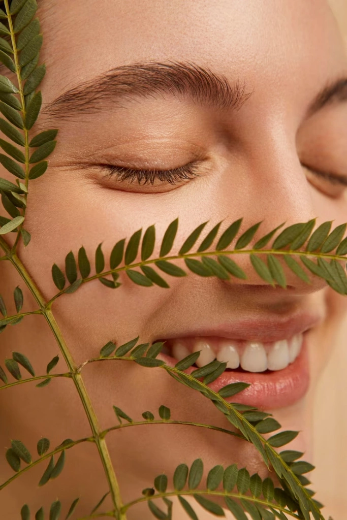 close-up-smiley-model-posing-with-plant_23-2148888223.jpeg